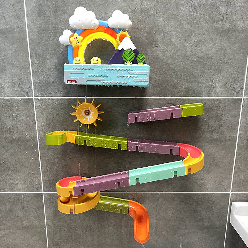 Marble run play set with suction cups for mounting on a wall.
